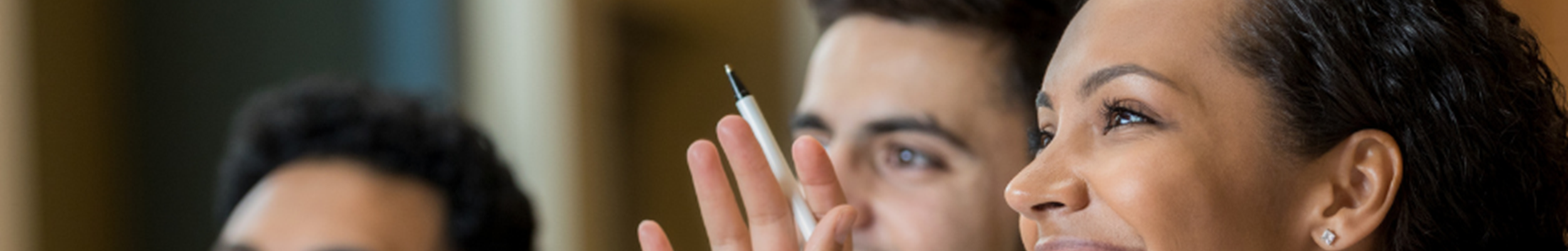 Group of people sitting at a desk