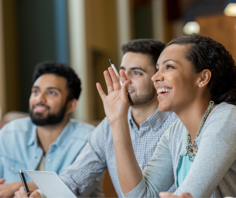 Group of people sitting at a desk