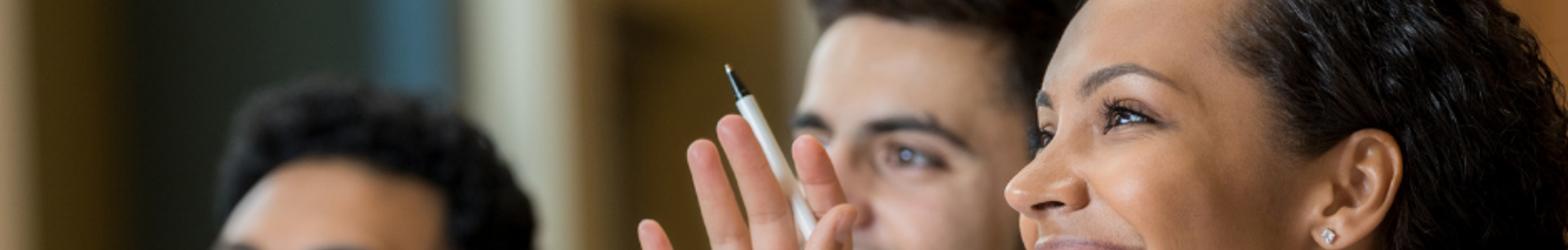 Group of people sitting at a desk