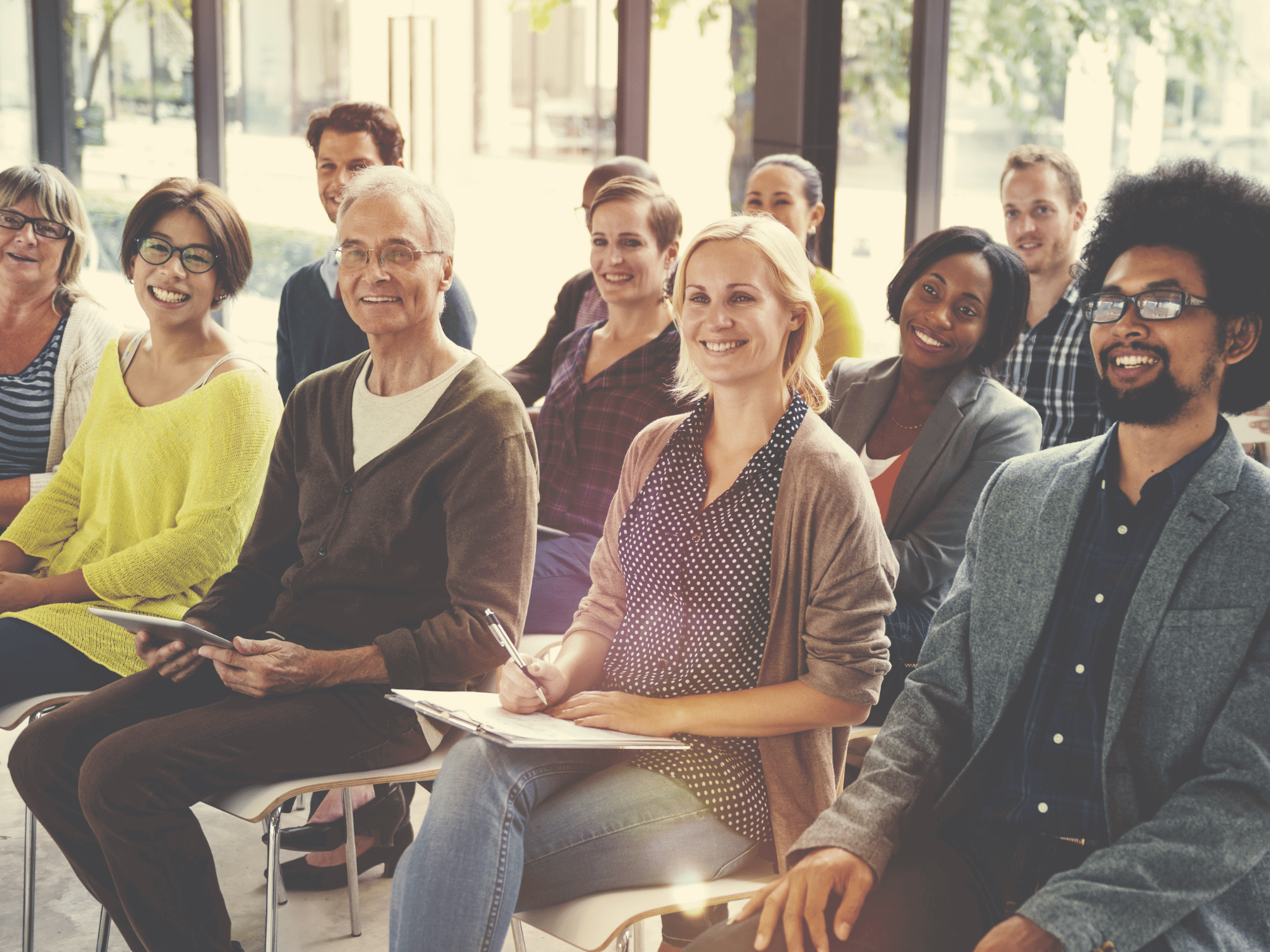 Group of people sitting on chairs