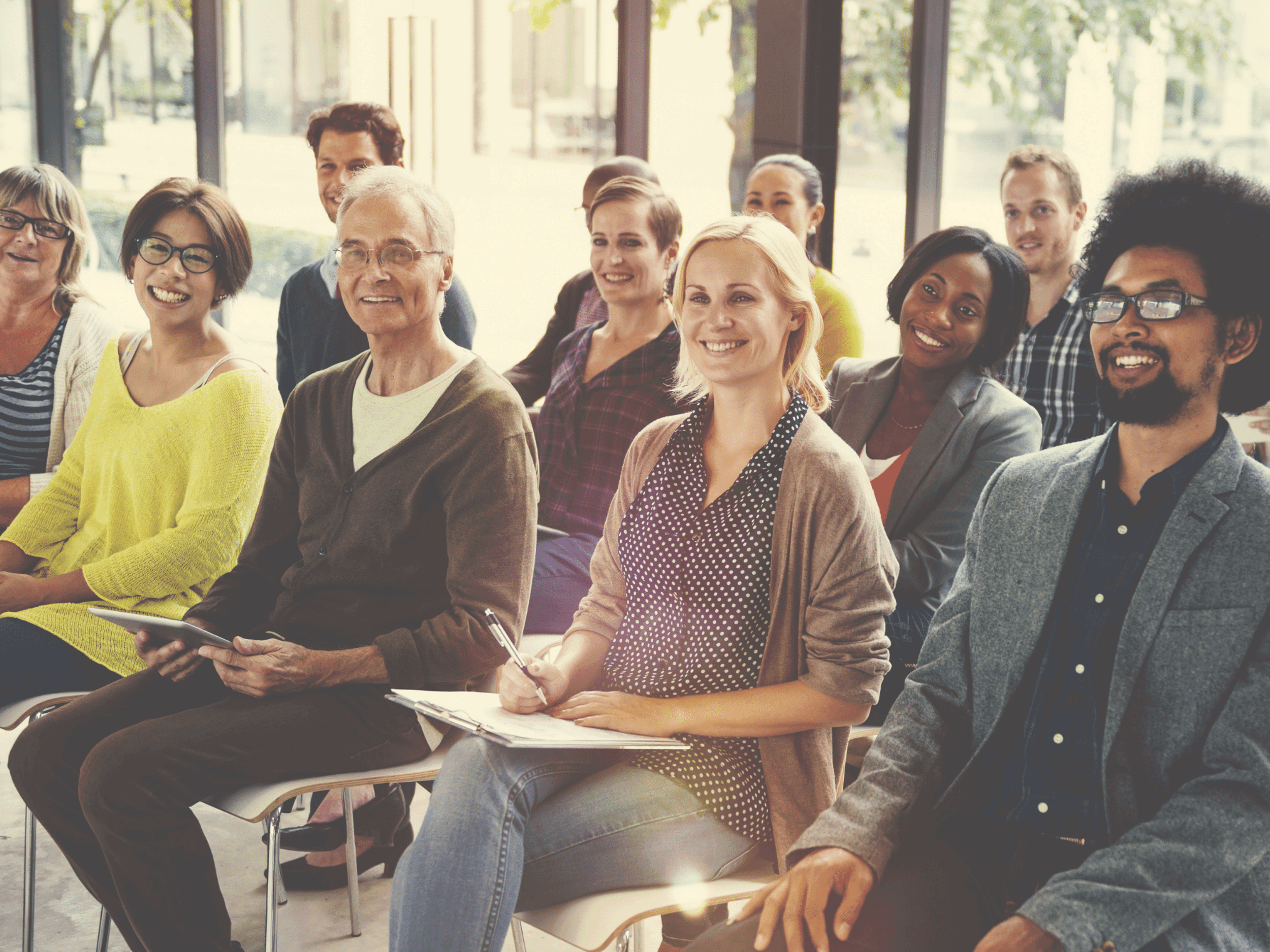 Group of people sitting on chairs
