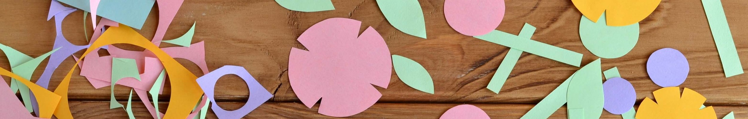 Paper shapes scattered on a desk