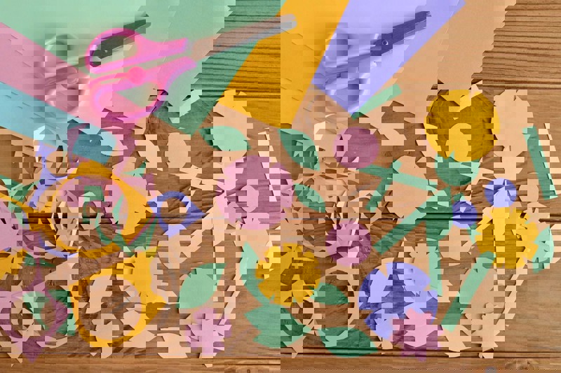 Paper shapes scattered on a desk