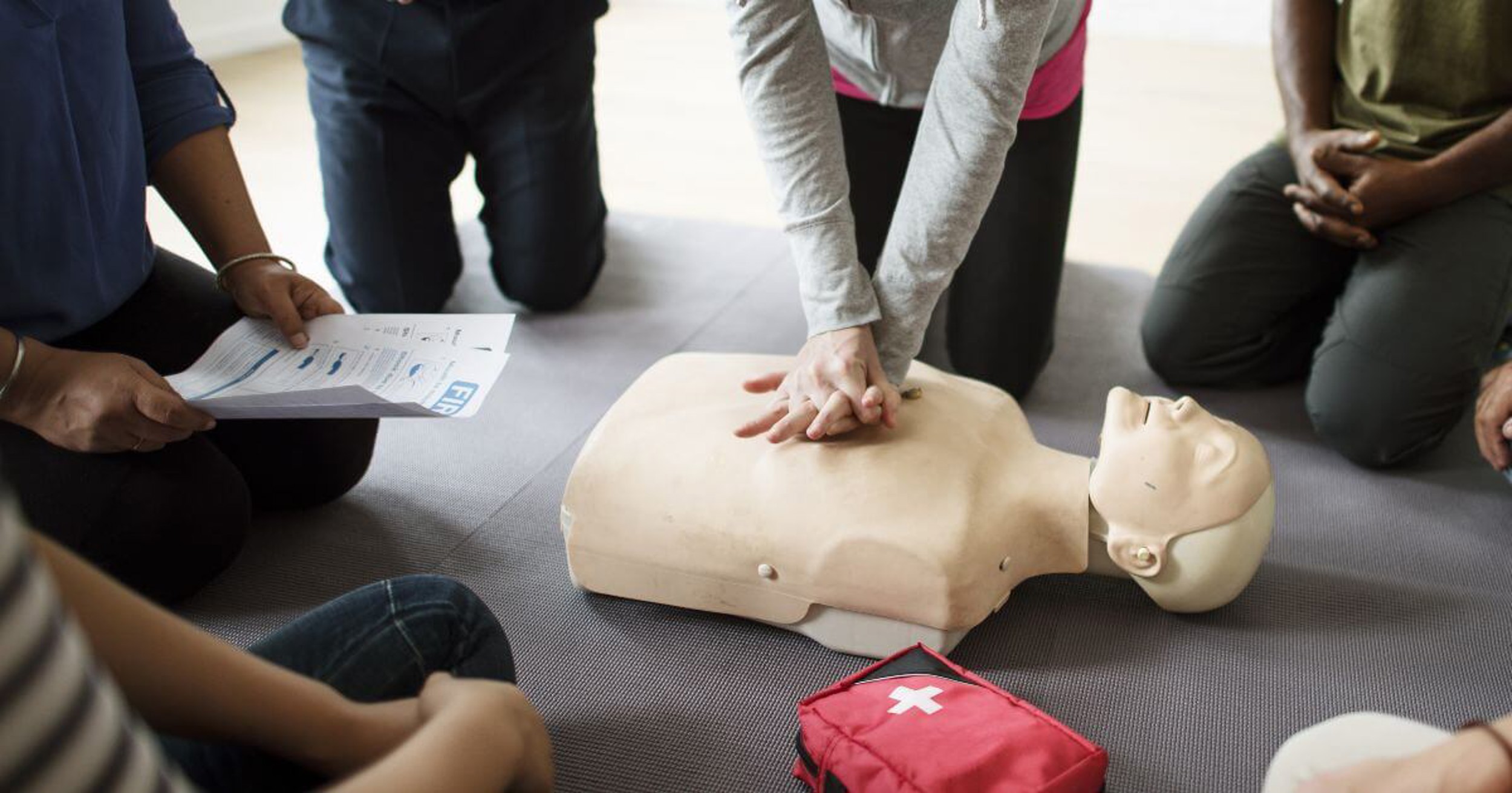 Group of people learning first aid