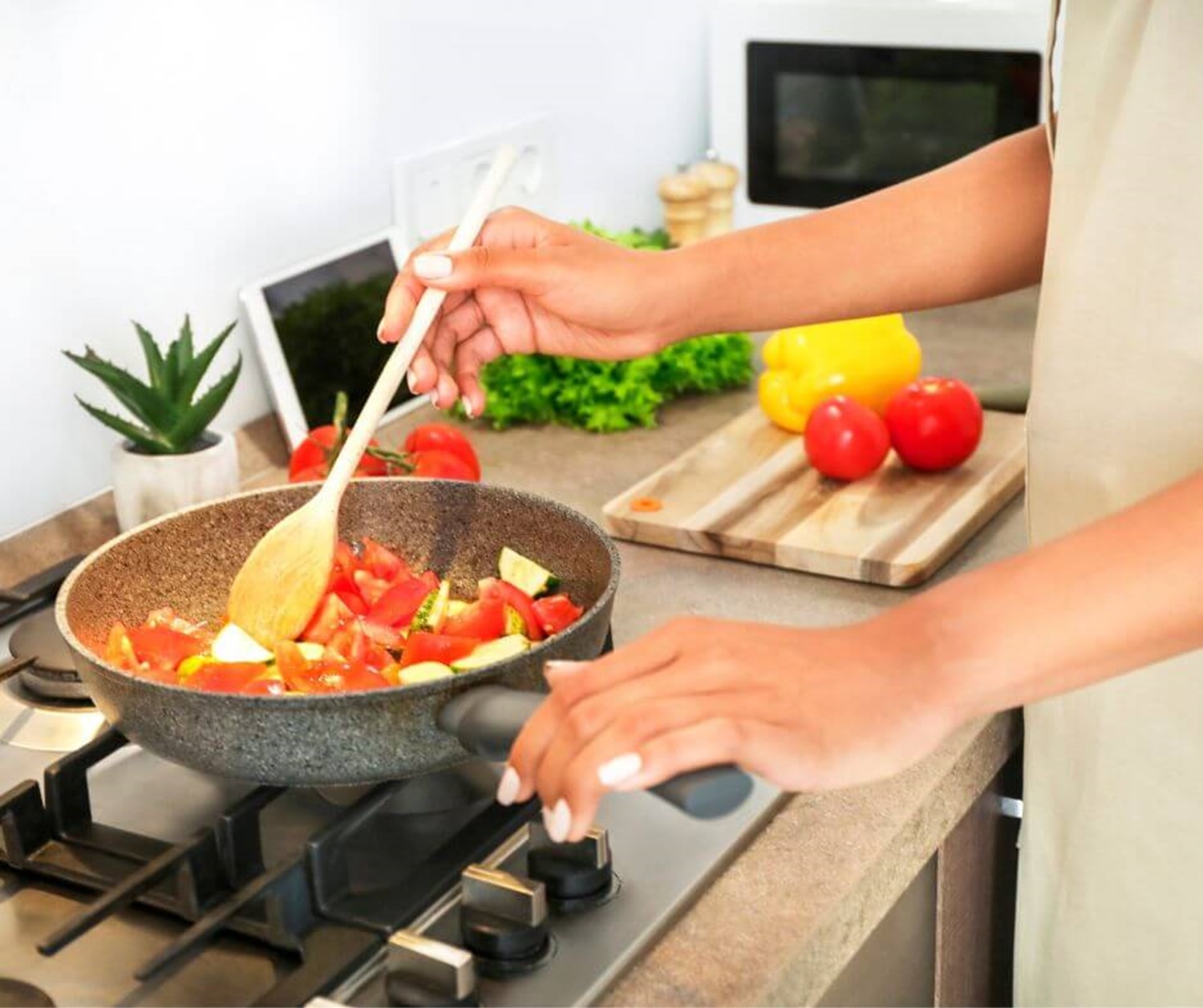 Person cooking vegetables