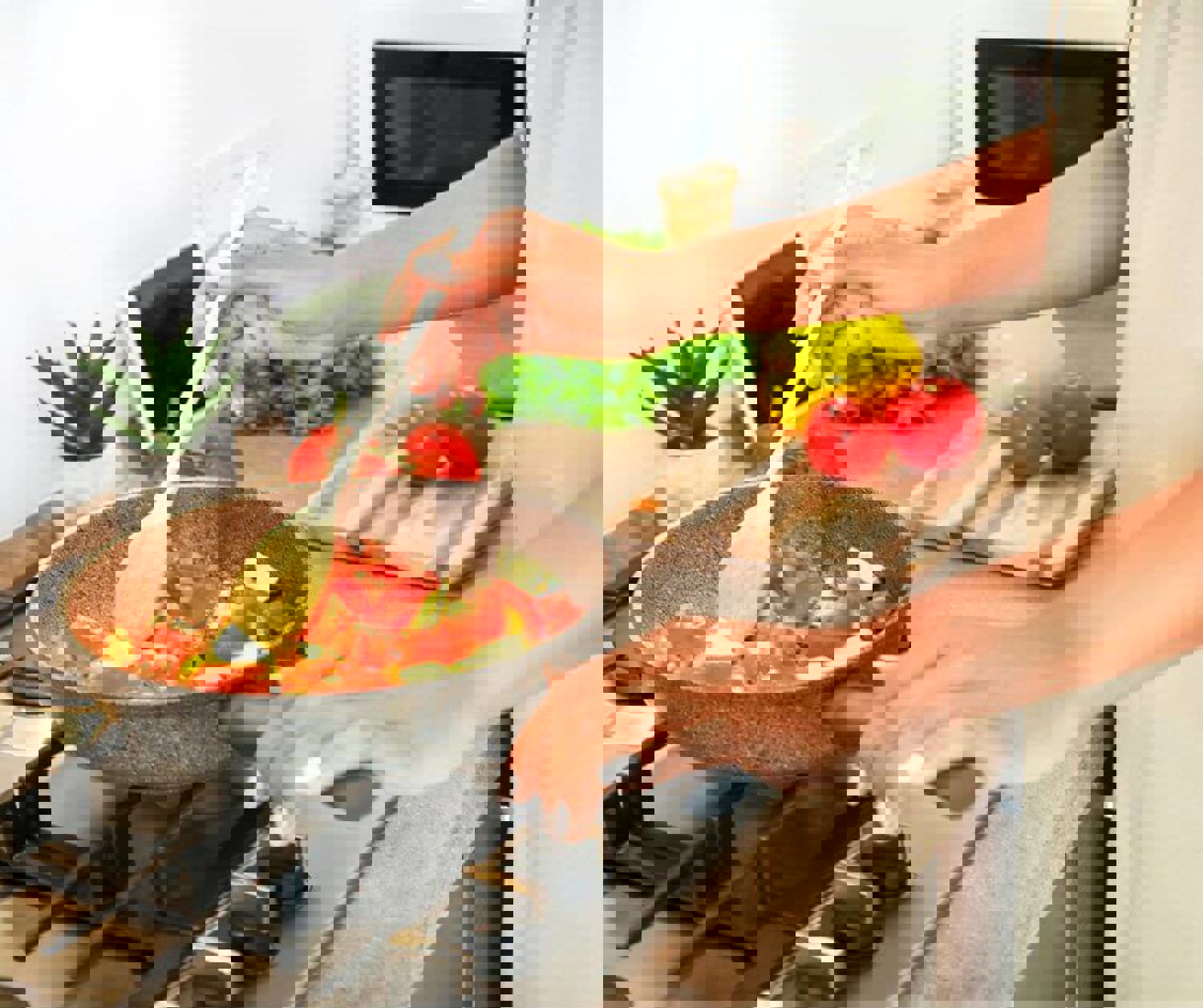 Person cooking vegetables