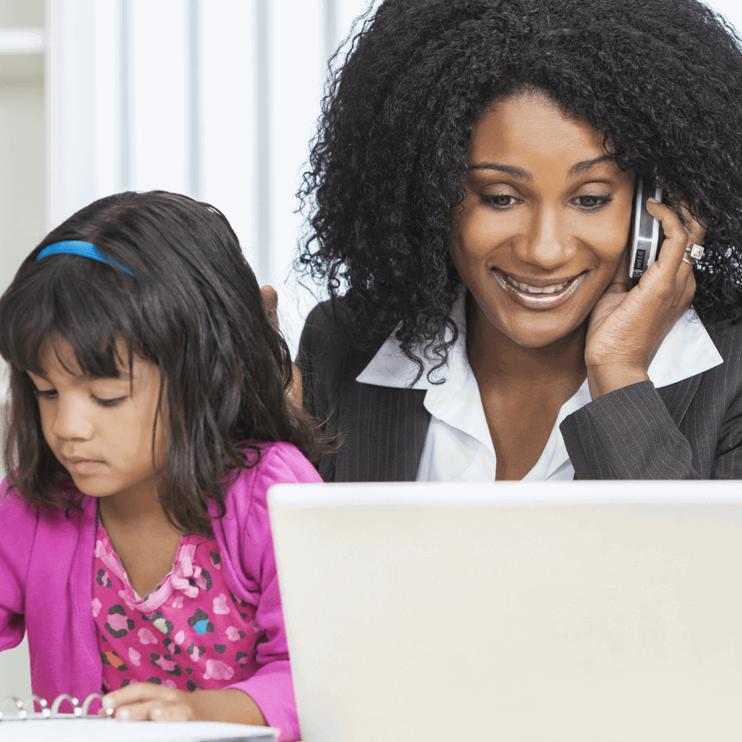 Parent and child sitting at a table